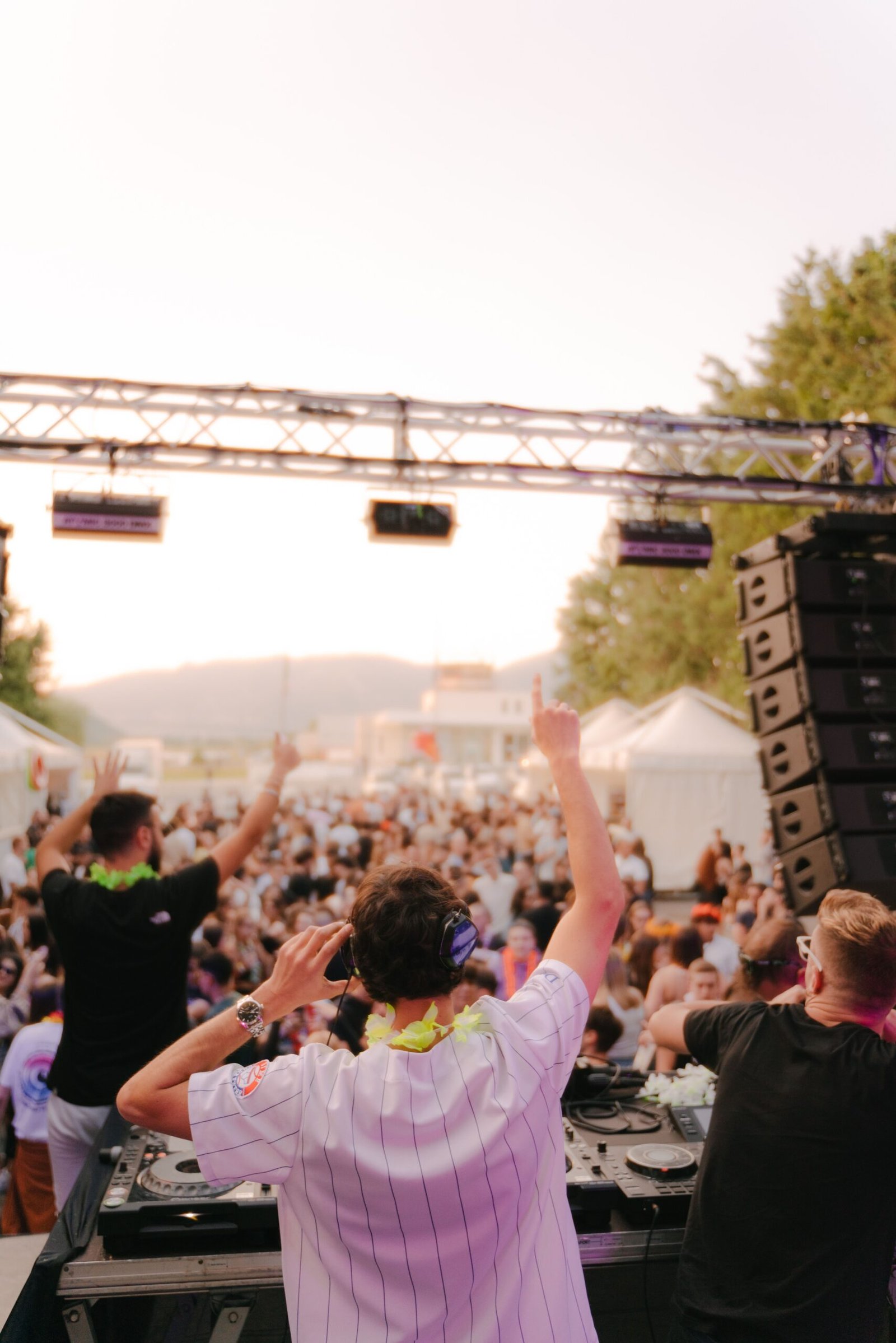 DJ and crowd enjoying a lively music festival in Abruzzo, Italy.